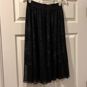 XXS Lola LuLaRoe shirt. Mesh overlay of black w/ white flower pattern